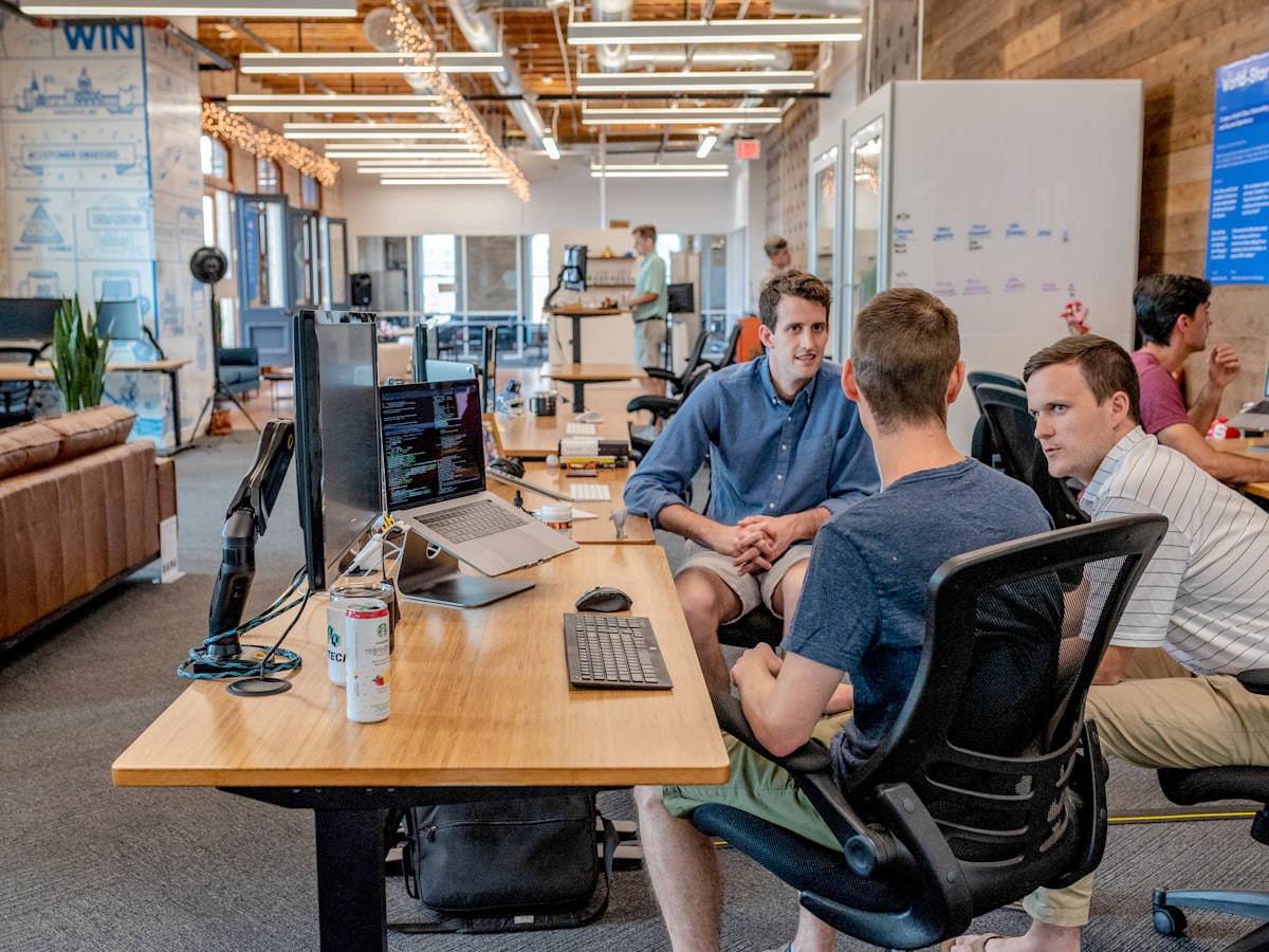 Business team collaborating on CRM and ERP software